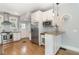 Well-appointed kitchen featuring stainless steel appliances, granite countertops, and eat-in island at 338 E Anderson St, Orlando, FL 32801