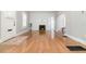 Bright living room with hardwood floors, fireplace, and fresh paint throughout the home at 338 E Anderson St, Orlando, FL 32801