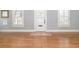 Bright living room with hardwood floors, fresh paint and shuttered windows at 338 E Anderson St, Orlando, FL 32801