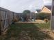 Cozy backyard firepit area with chairs and privacy fence, perfect for outdoor entertaining at 340 Haversham Way, Davenport, FL 33897