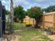 Serene backyard featuring a privacy fence and a variety of trees and plants at 340 Haversham Way, Davenport, FL 33897