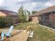 Picturesque backyard with solar panels, wood fence, and a relaxing seating area with chair at 340 Haversham Way, Davenport, FL 33897