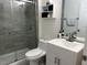 Beautiful bathroom featuring a glass-enclosed shower, modern vanity, and stylish fixtures at 340 Haversham Way, Davenport, FL 33897