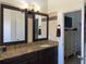 Bathroom featuring a double vanity with granite countertop at 340 Haversham Way, Davenport, FL 33897