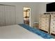 Bedroom features a view to a bathroom and a flat-screen TV atop matching dressers with great natural light at 340 Haversham Way, Davenport, FL 33897