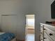 View into ensuite bathroom with large tub, tile flooring, walk-in closet and dresser storage at 340 Haversham Way, Davenport, FL 33897