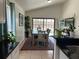 Cozy dining room with pool view, dining table with seating, and modern decor at 340 Haversham Way, Davenport, FL 33897