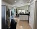 Bright kitchen featuring stainless steel appliances, white cabinets, and an open layout for easy access to dining at 340 Haversham Way, Davenport, FL 33897