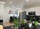 Well-lit kitchen featuring modern appliances, dark countertops, and ample storage space for all your culinary needs at 340 Haversham Way, Davenport, FL 33897