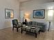 Cozy living room featuring neutral walls, tile flooring, and stylish furniture arrangement at 340 Haversham Way, Davenport, FL 33897