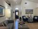 Bright and airy living room with tile flooring, high ceilings, and comfortable seating arrangement at 340 Haversham Way, Davenport, FL 33897