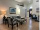 Comfortable living room with tile flooring, neutral walls, and ample seating options at 340 Haversham Way, Davenport, FL 33897