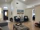 Spacious living room with high ceilings, neutral decor, tile flooring and comfortable seating at 340 Haversham Way, Davenport, FL 33897