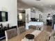 Open layout combines dining and kitchen areas, offering seamless flow and plenty of natural light at 340 Haversham Way, Davenport, FL 33897