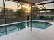 Relaxing screened-in pool area with mature landscaping for privacy and a great backyard retreat at 340 Haversham Way, Davenport, FL 33897