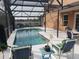A view of the pool area featuring a clear blue pool, covered lanai, and cozy seating at 340 Haversham Way, Davenport, FL 33897