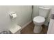 Bright powder room featuring a toilet, trash can and toilet paper holder at 340 Haversham Way, Davenport, FL 33897