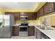 Bright kitchen with stainless steel appliances, sleek countertops, and updated fixtures at 3475 Flossmoor Ave # 103, Orlando, FL 32822