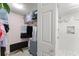 Organized walk-in closet next to modern shower showcasing storage solutions and ample space at 3475 Flossmoor Ave # 103, Orlando, FL 32822