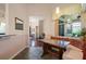 Breakfast nook with a glass table, banquette seating, and a view to the outside at 3696 Peacepipe Ct, Clermont, FL 34711