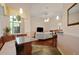Bright breakfast nook with banquette seating, glass table, and open to the living room at 3696 Peacepipe Ct, Clermont, FL 34711