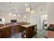 Expansive kitchen featuring abundant storage, modern appliances, and access to laundry room at 3696 Peacepipe Ct, Clermont, FL 34711