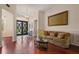 Inviting living room with wainscoting, hardwood floors, and decorative chandelier at 3696 Peacepipe Ct, Clermont, FL 34711