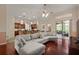 Open-concept living room with stylish ceiling fan and seamless flow to the kitchen at 3696 Peacepipe Ct, Clermont, FL 34711