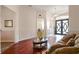 Spacious living room with beautiful floors, high ceilings, and a glimpse of the foyer at 3696 Peacepipe Ct, Clermont, FL 34711
