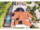 This house has a beautiful red tile roof, solar panels, and a screened-in pool for endless summer fun at 3844 Bowfin Trl, Kissimmee, FL 34746