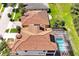 This gorgeous home features a tile roof, solar panels and a screened in pool at 3844 Bowfin Trl, Kissimmee, FL 34746