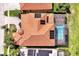 This stunning home boasts a terracotta roof, solar panels, and an inviting screened-in pool area at 3844 Bowfin Trl, Kissimmee, FL 34746
