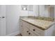 Bathroom featuring a granite countertop and vanity with black hardware at 3844 Bowfin Trl, Kissimmee, FL 34746