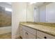 Bathroom featuring vanity with granite countertop and tiled shower and tub combo at 3844 Bowfin Trl, Kissimmee, FL 34746