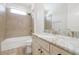Bright bathroom with a tub and shower combination and a marble countertop vanity at 3844 Bowfin Trl, Kissimmee, FL 34746
