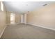Expansive bedroom with neutral walls, carpet, and ensuite access, offering a blank canvas at 3844 Bowfin Trl, Kissimmee, FL 34746