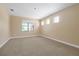 Spacious bedroom with carpet and bright natural light from large window at 3844 Bowfin Trl, Kissimmee, FL 34746
