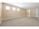 Large bedroom with plush carpeting, neutral tones, and an abundance of natural light at 3844 Bowfin Trl, Kissimmee, FL 34746