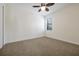 An empty bedroom with carpet and a ceiling fan is ready for its new owner at 3844 Bowfin Trl, Kissimmee, FL 34746