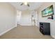 Cozy bedroom with carpet, ceiling fan, and access to walk-in closet, perfect for storage at 3844 Bowfin Trl, Kissimmee, FL 34746
