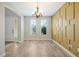 Dining room with unique wall décor, tile floors, a modern chandelier, and ample natural light at 3844 Bowfin Trl, Kissimmee, FL 34746