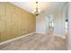 Dining room featuring decorative wainscoting, a chandelier, and tile floors at 3844 Bowfin Trl, Kissimmee, FL 34746