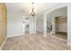 Spacious dining area that leads into the kitchen and staircase through archways at 3844 Bowfin Trl, Kissimmee, FL 34746