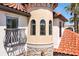 Architectural details of turret with three arched windows and red tile roof at 3844 Bowfin Trl, Kissimmee, FL 34746