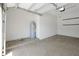Garage with white walls and water heater at 3844 Bowfin Trl, Kissimmee, FL 34746