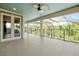 Expansive lanai with screened enclosure, providing an outdoor living space with peaceful views at 3844 Bowfin Trl, Kissimmee, FL 34746