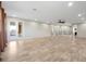Bright and airy living room featuring tile floors, recessed lighting, and a modern ceiling fan at 3844 Bowfin Trl, Kissimmee, FL 34746