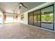 Spacious covered patio with ceiling fans and screened enclosure overlooking the backyard at 3844 Bowfin Trl, Kissimmee, FL 34746