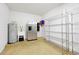 Unfinished storage room with water heater, utility sink, and shelving at 3844 Bowfin Trl, Kissimmee, FL 34746