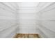 A walk-in closet with metal shelving at 3844 Bowfin Trl, Kissimmee, FL 34746
